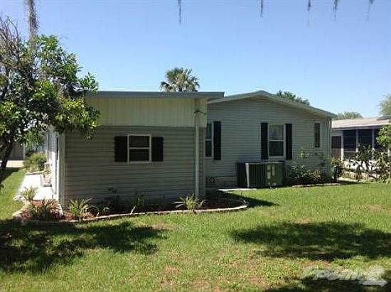 Back of Home with Storage Shed