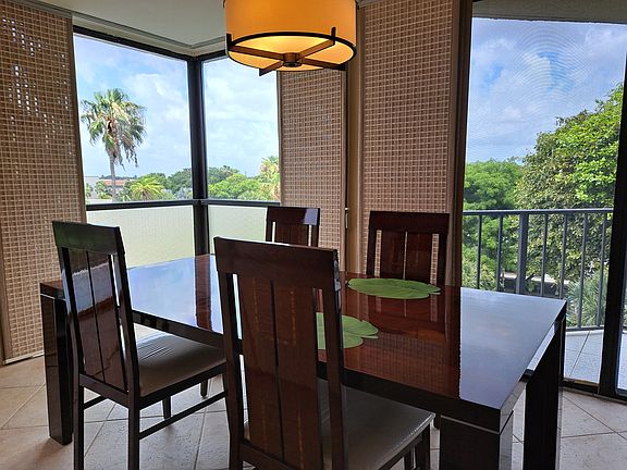 Dining Table by corner windows