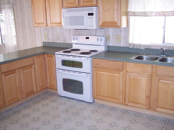 Ample counter space and cabinet storage. Double oven and the whole kitchen is light and bright and open to the living room!