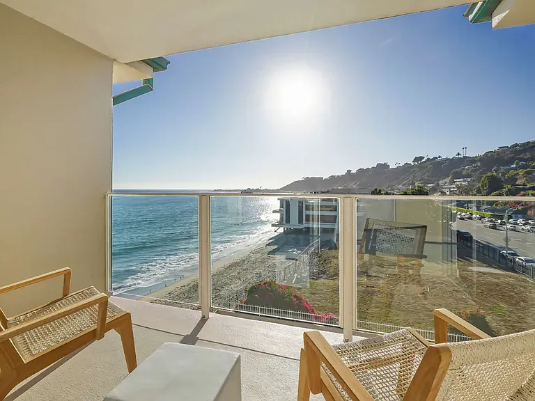 Breathtaking ocean views await from the balcony _ a perfect spot to unwind.