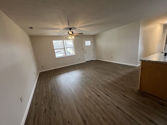 Large open concept living room / kitchen from the back door