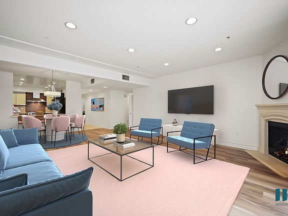 Large-Size Open-Concept Kitchen, Dining, and Living Room Space with Fireplace