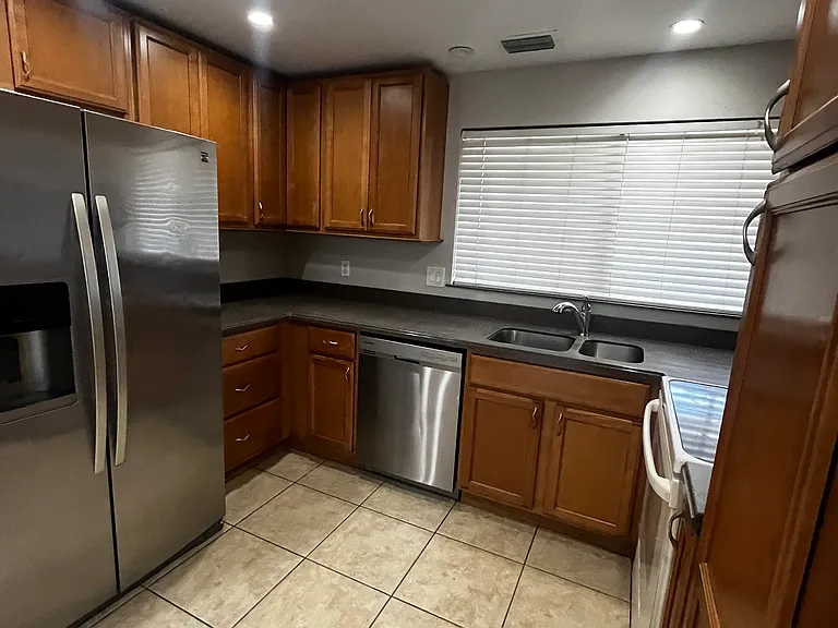 Kitchen: Fridge, Dishwasher, Electric Range with Cooktop, Microwave.