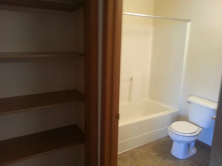 Bathroom with Linen Closet next to it.