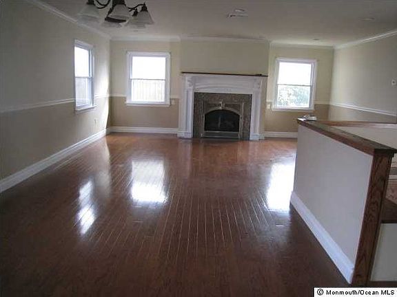 CUSTOM PECAN WOOD FLOORS IN THE LR/DR/FOYER