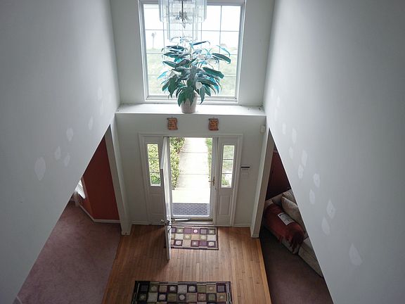 Two story Hardwood foyer