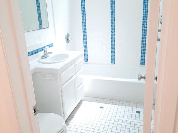 Full bathroom with tub.