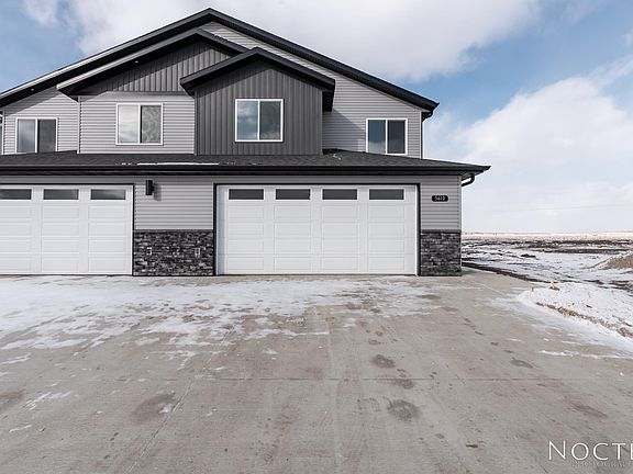 Beautiful twin home in Silver Ranch, one of the fastest growing subdivision in Bismarck with a new elementary school being built. Landscaping will be done this summer. (Photo of another unit with similar finishes and quality.)