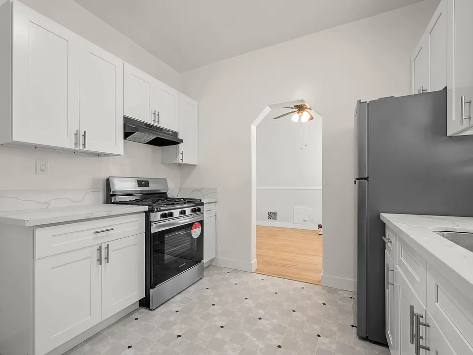 Kitchen. - It includes Stainless Steel Fridge and Stove. - Smoke Extractor.