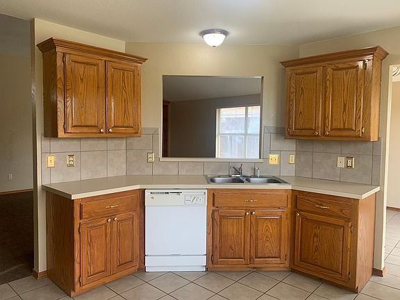 The kitchen looks out into the living room. Dining is to the right.