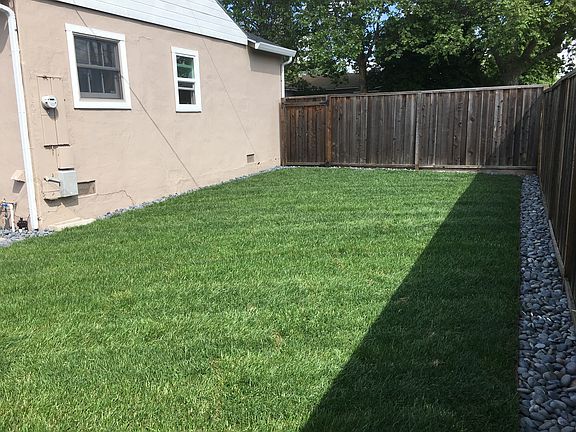 Backyard lawn w/sprinklers
