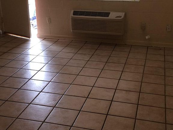 Entrance and AC unit. Some units floor is made of hardwood.
