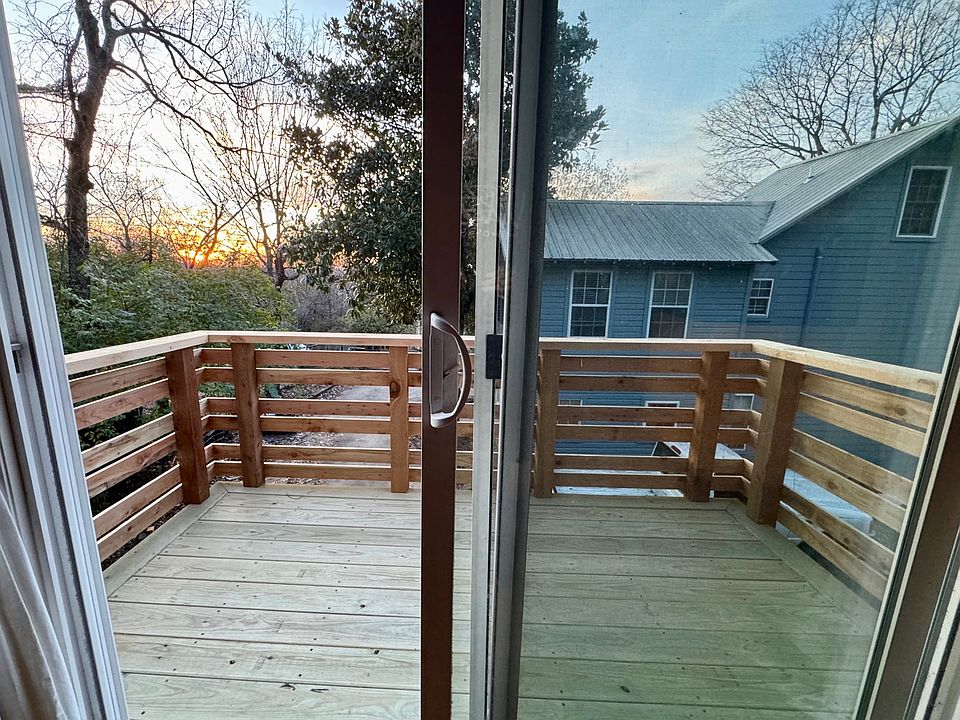 New deck (approx. 50 sq ft) with cedar railing. (The owners live in the blue house.)