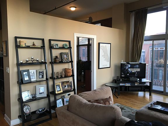 Living room: large windows, two balconies