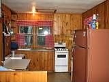 Knotty pine cabinets in kitchen