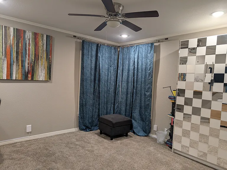 This oversized room has a Murphy Bed. It can be used as a bedroom, office, exercise or yoga room- or just a space to chill and read a book.