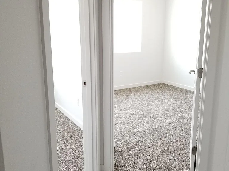 Looking into two of the three upstairs bedrooms.