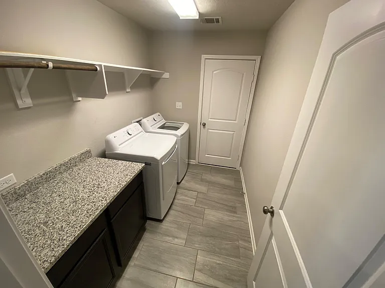 Laundry room with washer and dryer included