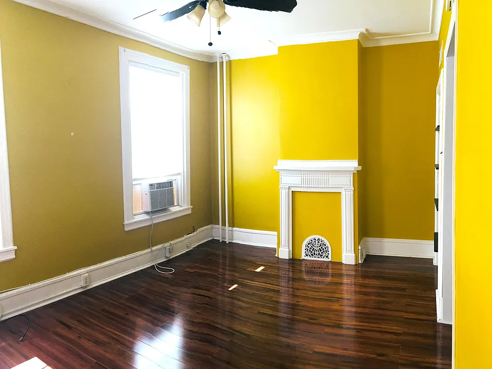 Living room with tigerwood floor and painted with a sunny designer color