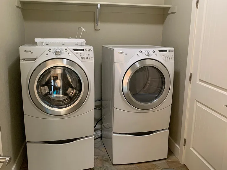 Whirlpool duets, including front loading washing machine. Plenty of space for air drying clothes in mudroom