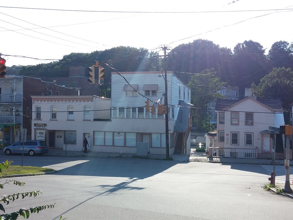 Street view + private driveway to parking between building