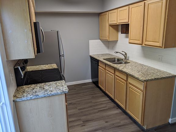 Kitchen with Granite countertops and ceramic backsplash