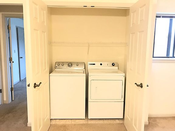 Laundry closet with French doors