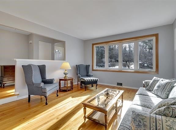 Step down to the formal living room from the entry foyer.  This home beams with pride of ownership.