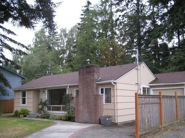 front of house, corner lot home with rv parking and attached garage