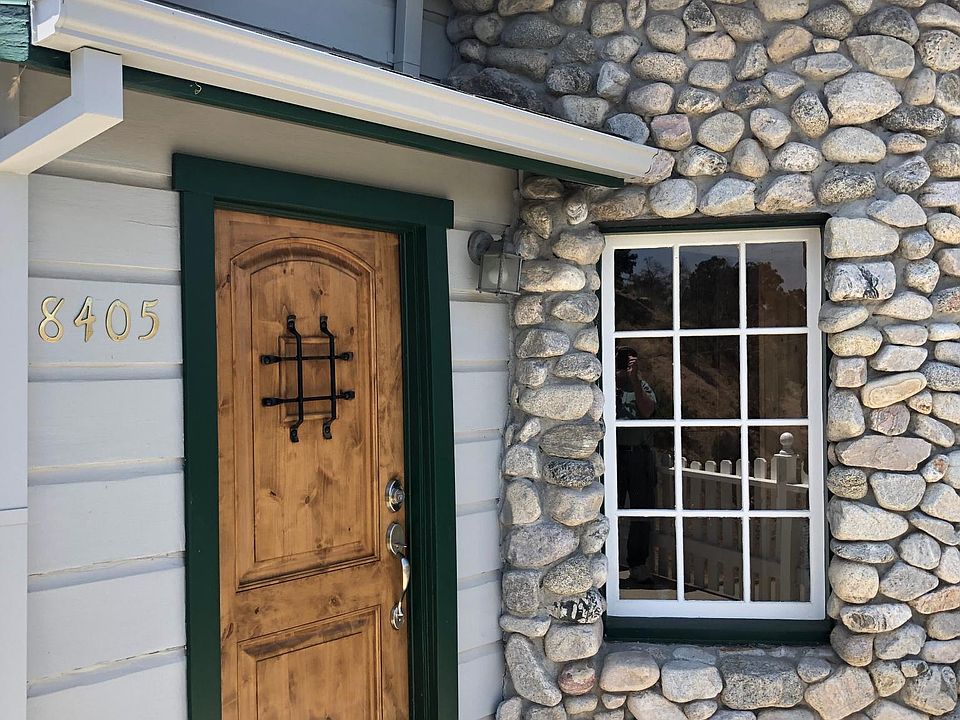 Front porch. A great place to hang out when you get home from work. River rock covering the bay window area.