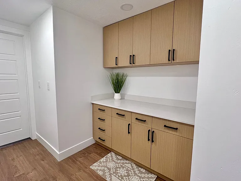 Shared laundry equipped with washer and dryer.