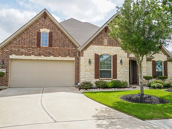 The double wide driveway leads to the 2 car garage.