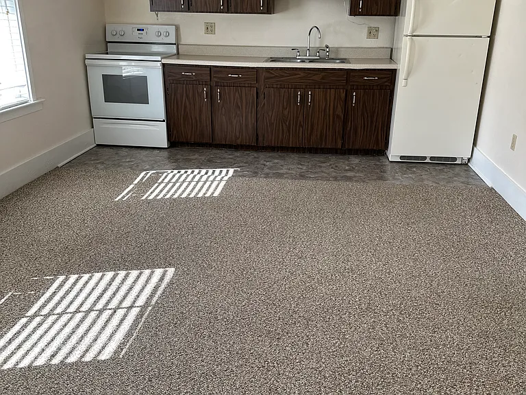 Kitchen at end of living room.