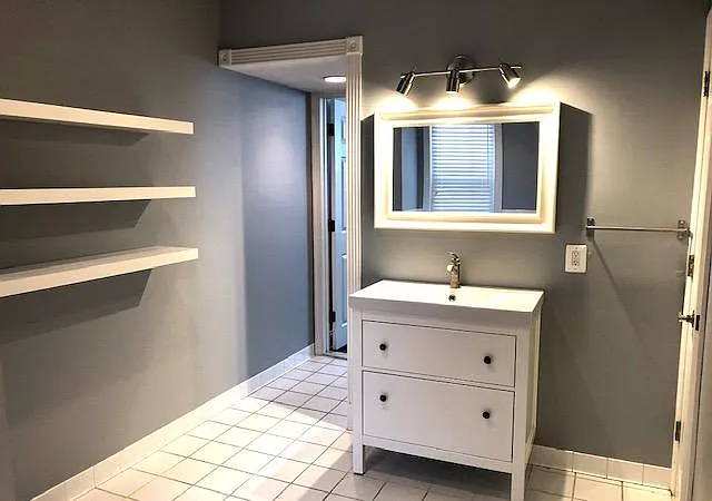 Master bathroom, contains small closet to right of vanity