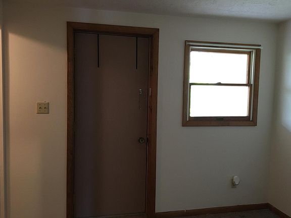 Bedroom view with back door to patio for privacy