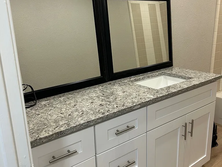 Guest bathroom with new cabinets and granite