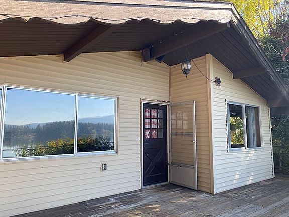 Cabin door from living room to deck that faces the lake.