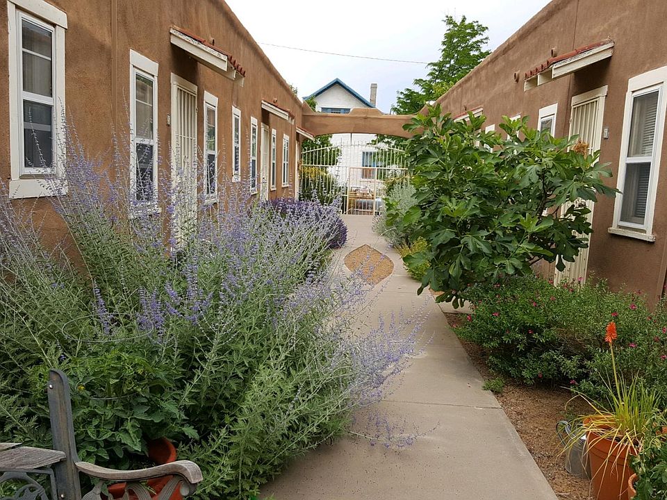 Interior courtyard with flowers, plants, herbs.