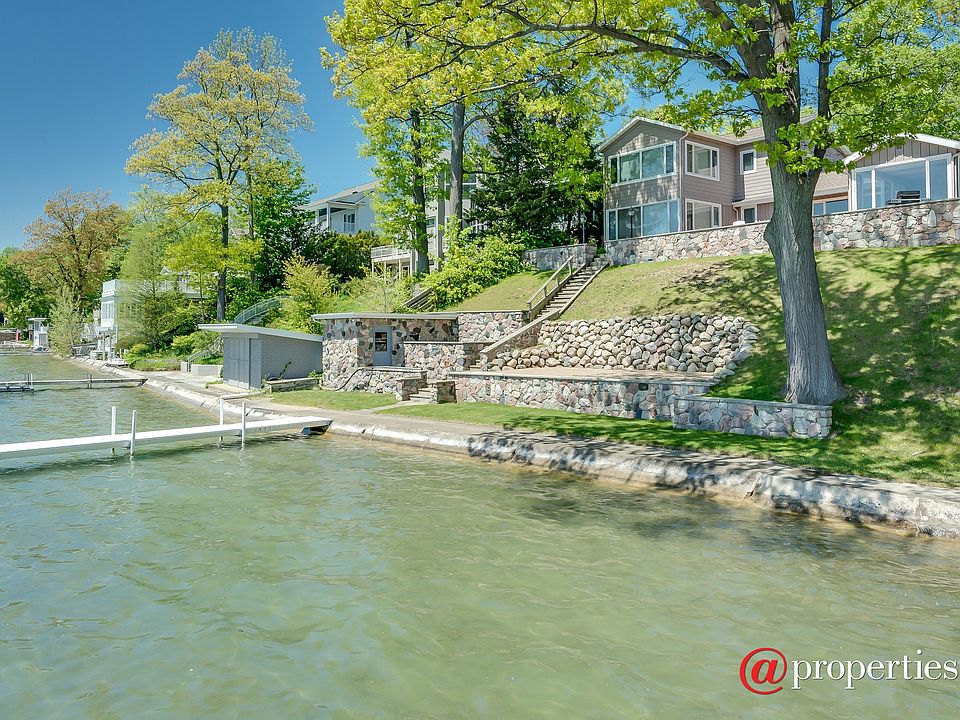 70' frontage with sea wall and lake side patio