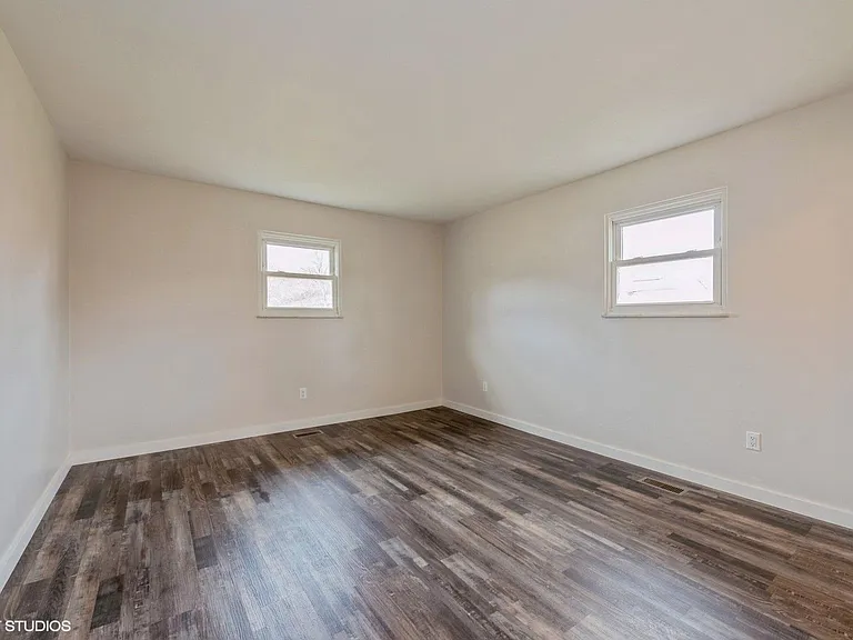Bedroom 1 with attached powder room
