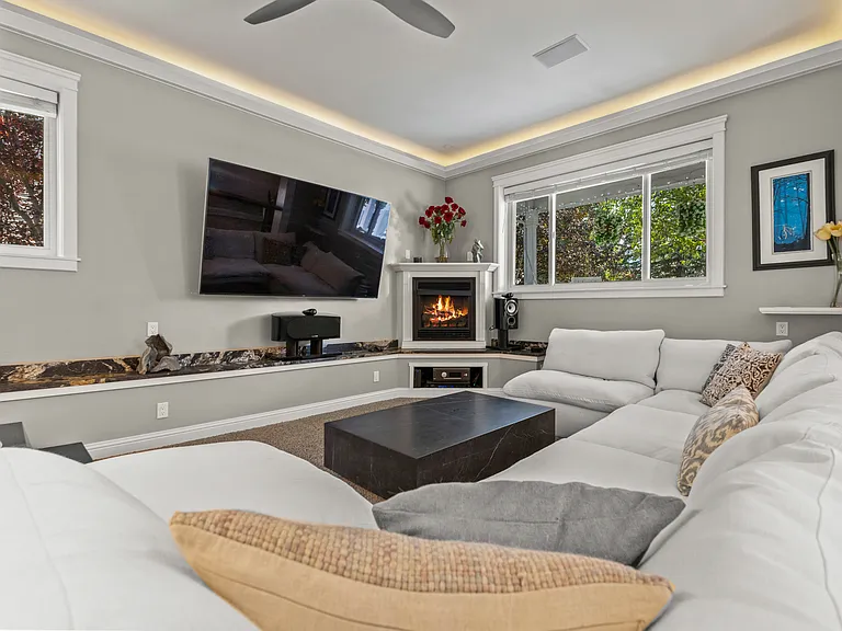 Living Room | Large Couch, Smart TV, and Fireplace