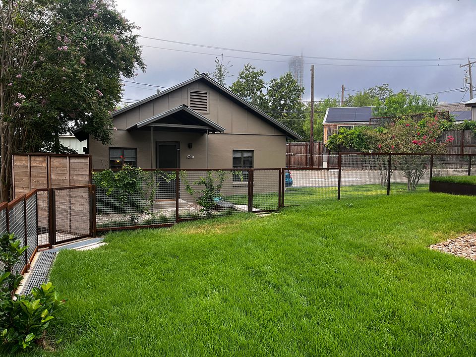 Front showing gated parking to the right