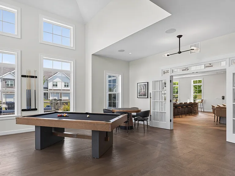 Resident Exclusive Game Room Featuring Billiards, Poker Table and Retro Arcade