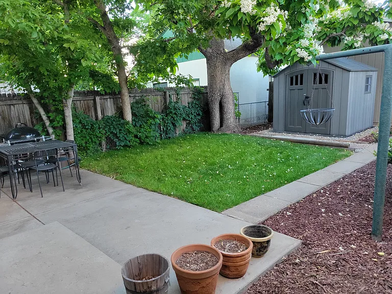 Large Patio and storage shed.

Flower pots included
