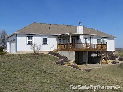 view of back with deck and patio
