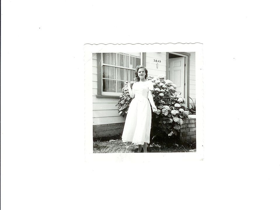 My mom, Emma Sharp, around 1955, in front of the house on Delta, her fam built