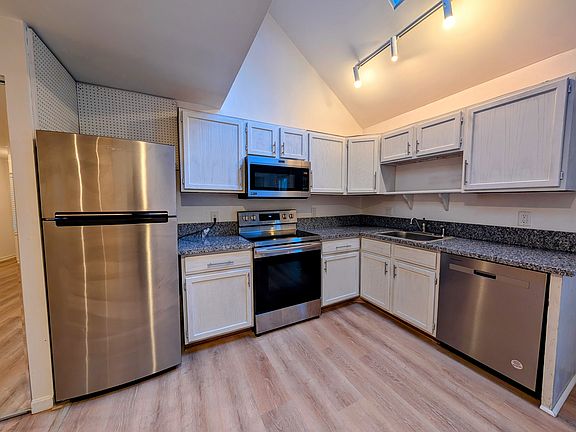 Spacious and open kitchen. Newer stainless steel appliances and granite countertops