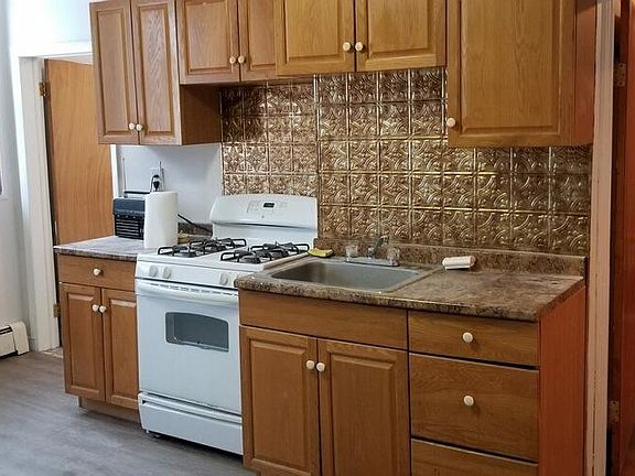 Vintage back splash, large windows.