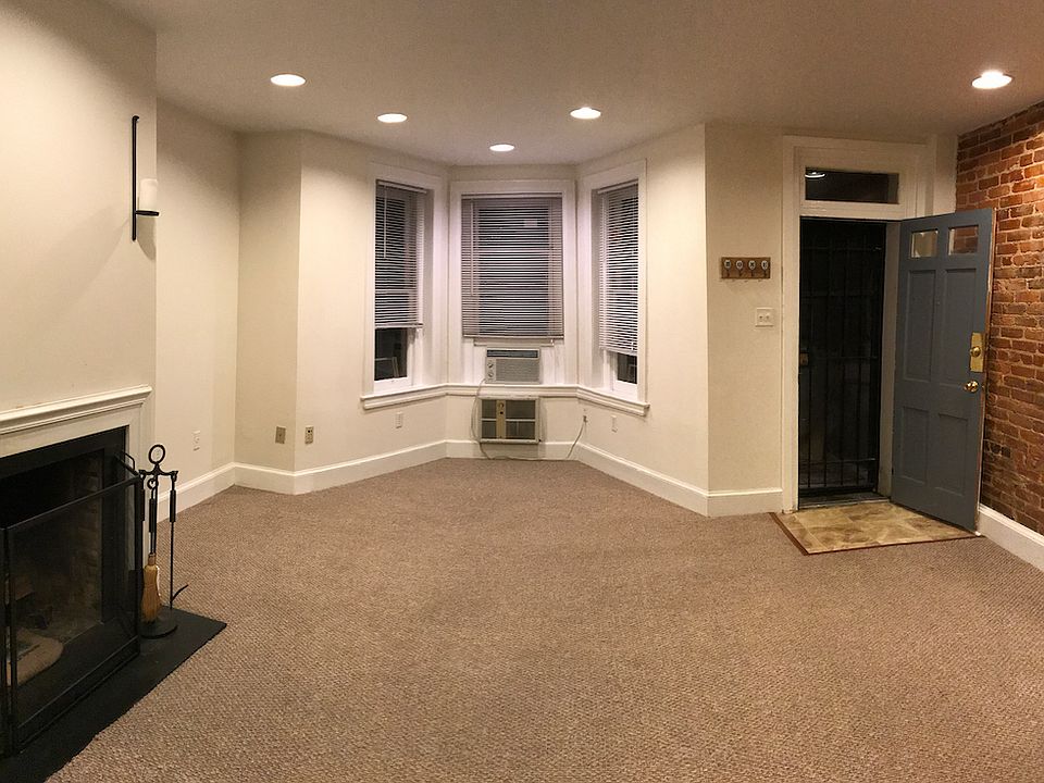 Front room with front door open