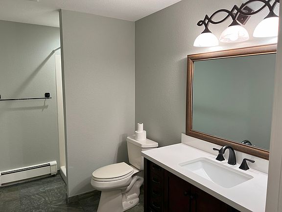 Unit B bathroom with standup shower.